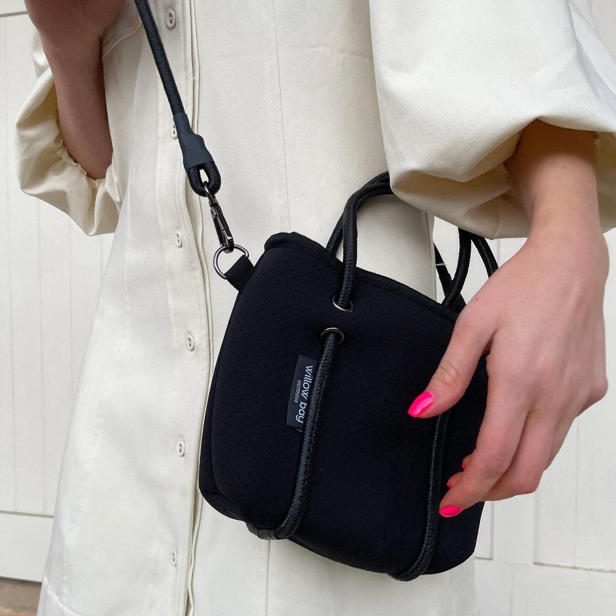 BOUTIQUE TINY Signature Neoprene Tote Bag With Zip - BLACK-Willow Bay BOUTIQUE TINY Signature Neoprene Tote Bag - Black Our signature collection is a unique addition to our Boutique Tiny range. With the same features as our traditional Boutique Tiny tote with the addition of the Willow Bay branded lining and the sailing rope handle in a single colour to match the bag. The newest addition to the Boutique Family, meet the Tiny! This bag is seriously cool. The perfect companion when needing to store only your