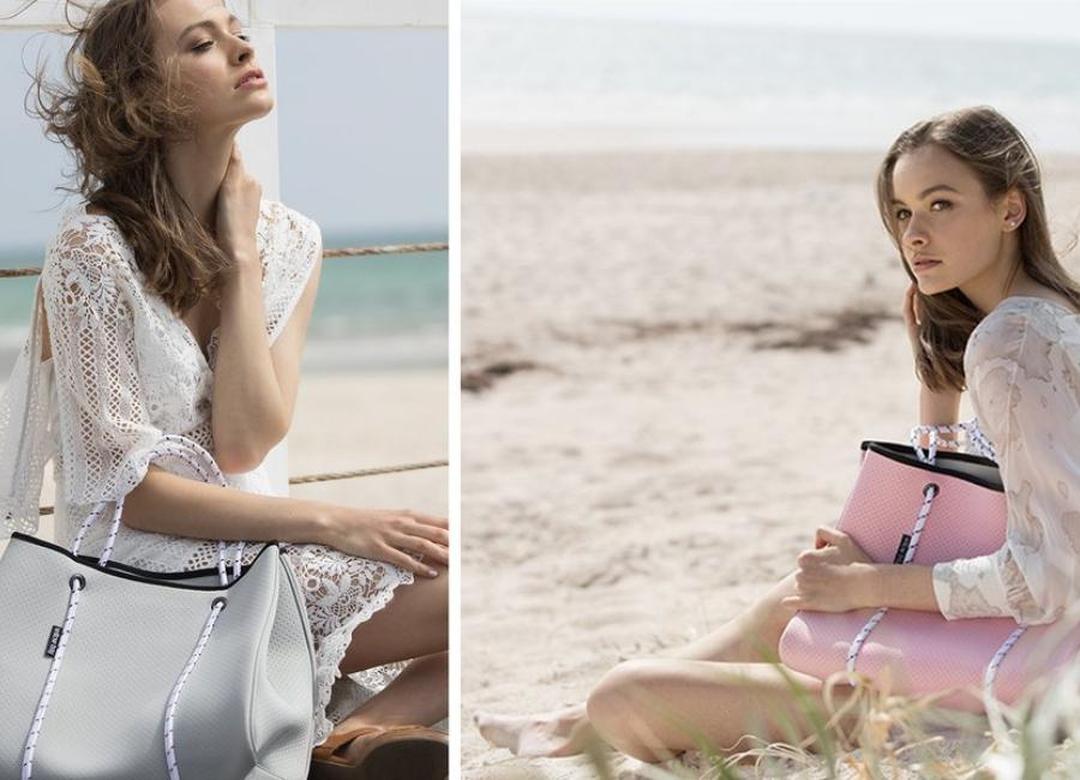 BEHIND EVERY WOMAN IS A FABULOUS HANDBAG